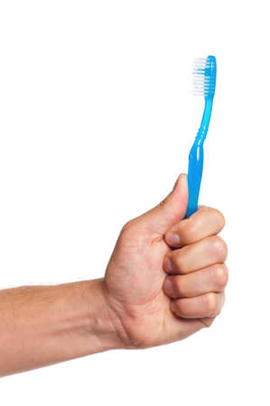 Man holding a toothbrush isolated on white backgroundの写真素材
