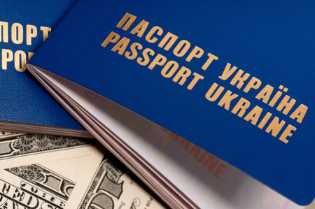 Two international Ukrainian passport on US dollars background