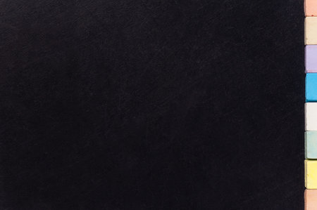 Empty blank black chalkboard with colorful chalk