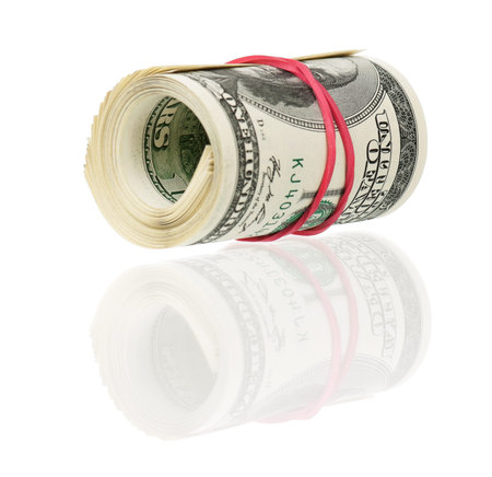 Roll of dollars with rubber band isolated on white background