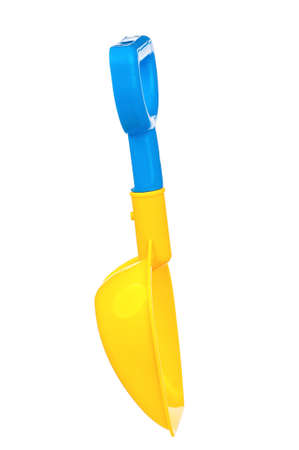 Toy small spade isolated on white backgroundの写真素材