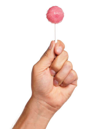Man hand with lollipop isolated on white backgroundの写真素材