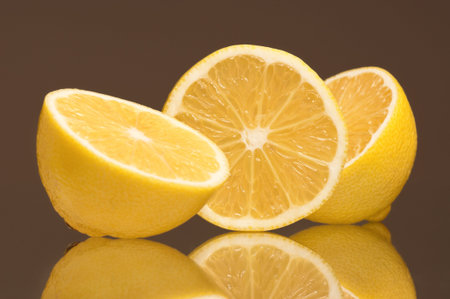Slice of fresh lemons isolated on grey background