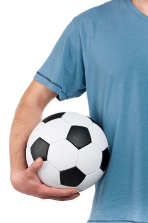 Man standing with classic soccer ball on isolated white backgroundの写真素材