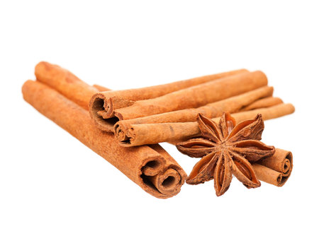Cinnamon sticks and star anise isolated on white background