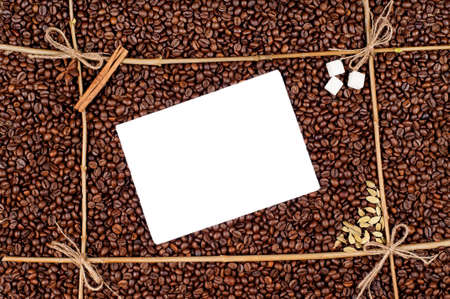 Frame made of coffee beans with blank paperの写真素材