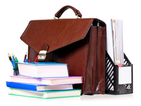 Brown leather briefcase with office accessories, isolated on white backgroundの写真素材