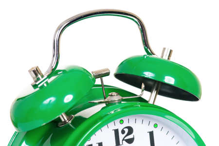 Close-up of green alarm clock on white backgroundの写真素材