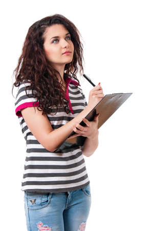 Smiling confident beautiful girl holding black folder and pen, isolated on white backgroundの写真素材
