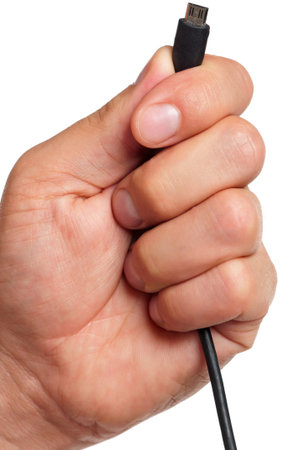 Close up of man hand holding USB connector on white