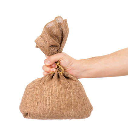 Man hand with small bag on white backgroundの写真素材