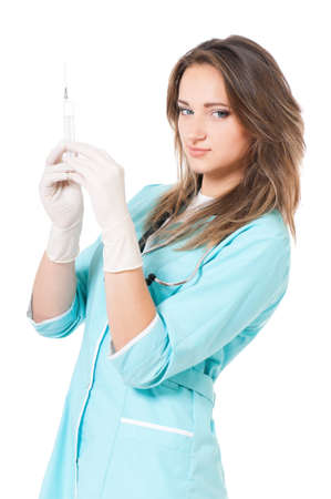 Beautiful young nurse with syringe, isolated on white backgroundの写真素材