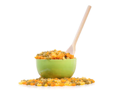 Raw pasta in bowl isolated on white background の写真素材