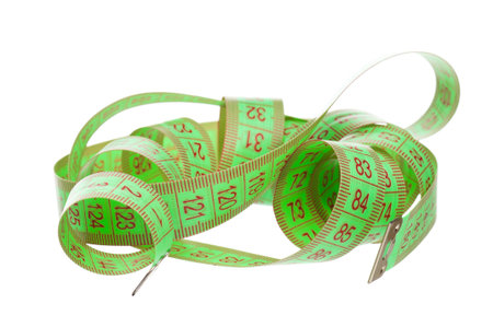 Measuring tape of the tailor over white background