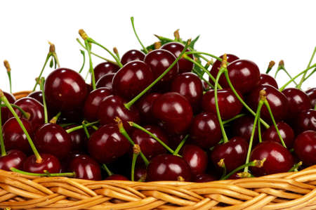 Sweet cherries in a basket isolated on a white backgroundの写真素材