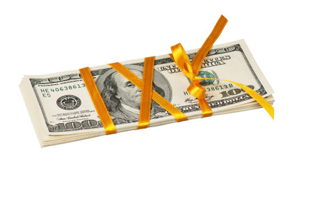 Heap of dollars with yellow ribbon isolated on a white background
