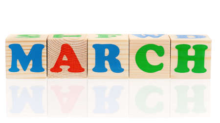 March word formed by wood alphabet blocks, isolated on white background の写真素材