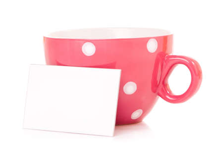 Big mug polka dot of tea and blank or empty paper with copyspace の写真素材