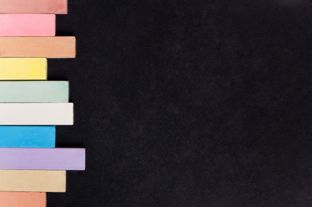 Empty blank black chalkboard with colorful chalk