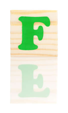 Wooden block with letter F, isolated on white backgroundの写真素材