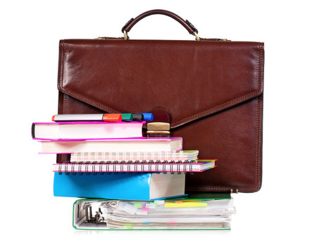 Brown leather briefcase with office accessories, isolated on white backgroundの写真素材