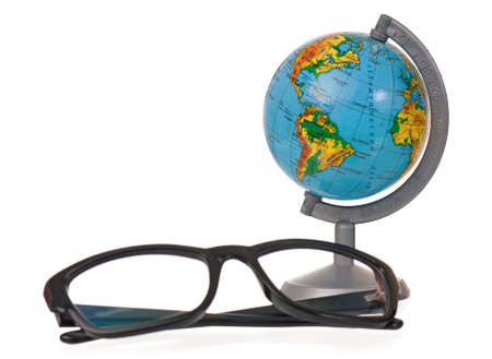 Small globe with black glasses on white background の写真素材