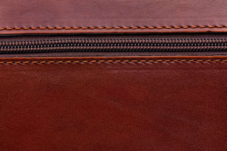 Close up of brown leather texture background with zipperの写真素材