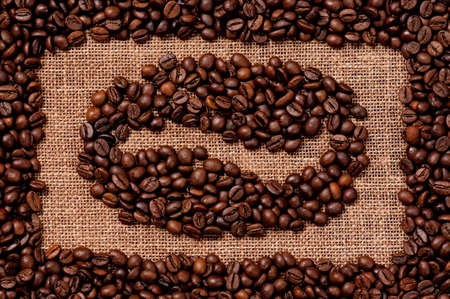 Coffee bean made of coffee beans on the old burlapの写真素材
