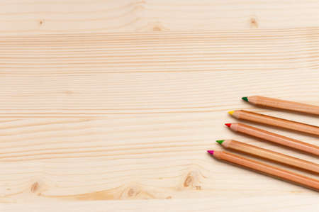 Back to school concept - color pencils on wooden background の写真素材