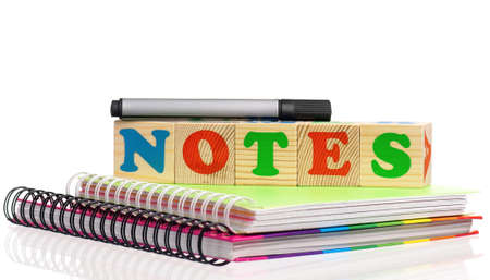 text of NOTES on cubes with notebook and marker on white backgroundの写真素材