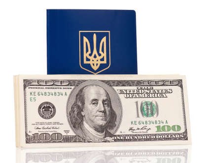 International Ukrainian passport with US dollars banknotes isolated on white backgroundの写真素材