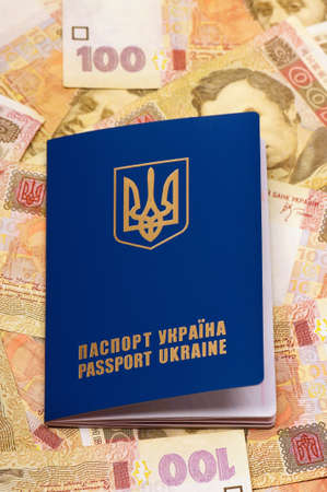 International Ukrainian passport on Hryvna banknotes backgroundの写真素材