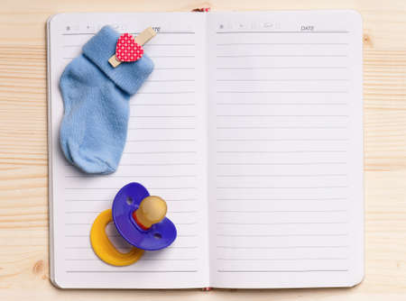 Blank notebook with kids nipple - top viewの写真素材