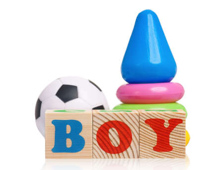 Boy word formed by wood alphabet blocks with pyramid on white backgroundの写真素材