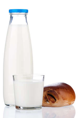 Bottle of milk and bun with poppy seeds, isolated on white backgroundの写真素材