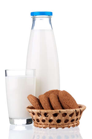 Bottle of milk and glass with cookies isolated on white backgroundの写真素材