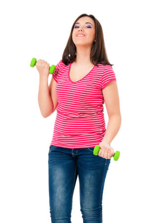 Happy girl with dumbbells, isolated on white backgroundの写真素材
