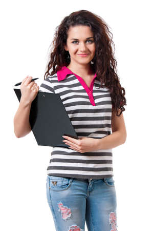 Teen girl holding a clipboard, isolated on white backgroundの写真素材