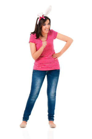 Happy teen girl with white rabbit ears, isolated on white backgroundの写真素材