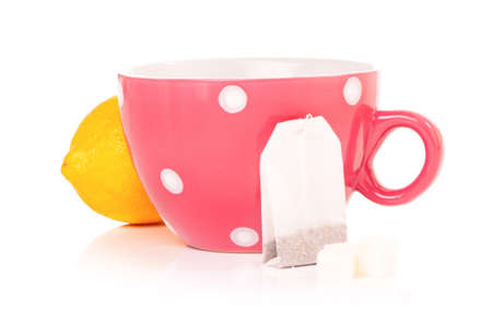 Tea cup with teabag and lemon. Isolated on white backgroundの写真素材