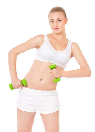 Portrait of fitness woman with dumbbells, isolated on white backgroundの写真素材