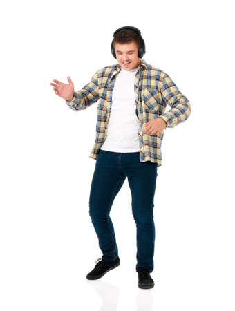 Young modern man with headphones isolated on white backgroundの写真素材