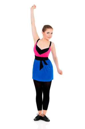 Young happy woman doing fitness exercise, isolated on white backgroundの写真素材