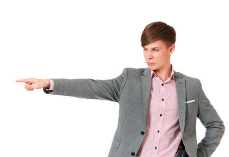 Happy young businessman showing empty copyspace on white backgroundの写真素材