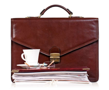 Brown leather briefcase with office accessories, isolated on white backgroundの写真素材
