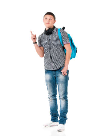 Young man with bag shows forefinger on something, isolated on white backgroundの写真素材