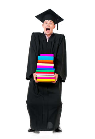 Young graduation man holding books, isolated on white backgroundの写真素材