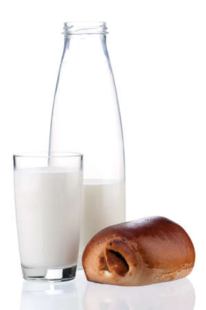 Bottle of milk and bun with poppy seeds, isolated on white backgroundの写真素材