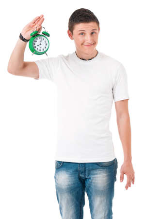 Young man with alarm clock isolated on white backgroundの写真素材