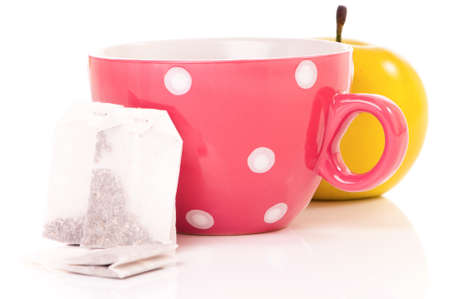 Tea cup with teabag, isolated on white backgroundの写真素材